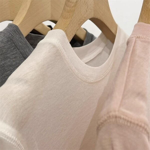 White base knitted summer T-shirt with a round collar