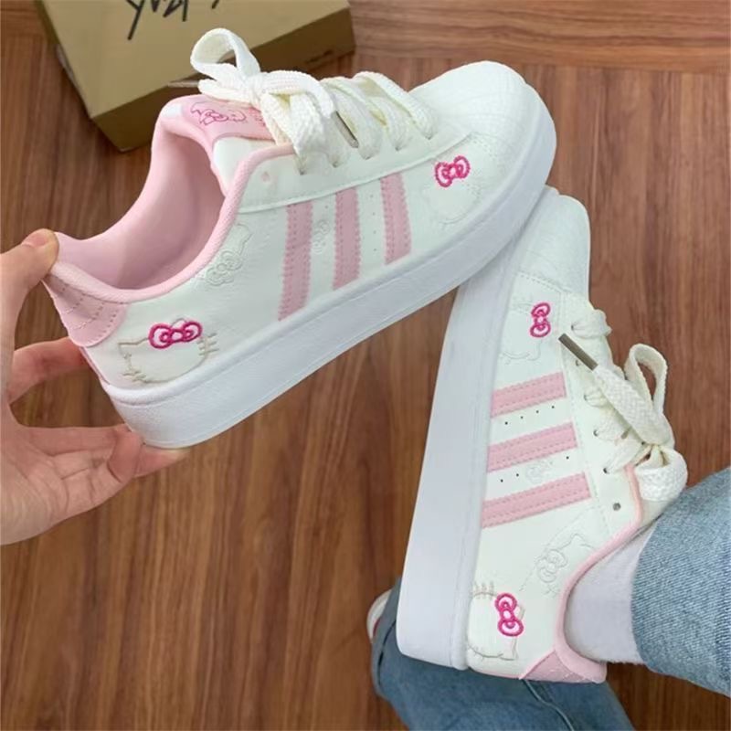2026 primavera nuevo polvo blanco gato zapatos de pan de cabeza de concha de mujer estilo de escuela zapatos de skate de nicho zapatos deportivos bajos
