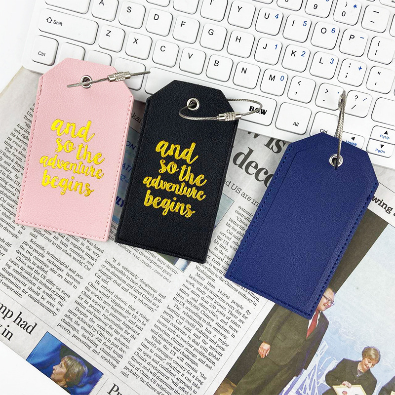 En stock tarjeta de embarque de cuero bronceado grueso de doble cara transfronteriza con tarjeta de papel de firma etiqueta de equipaje pu etiqueta de equipaje