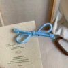 With bow, blue