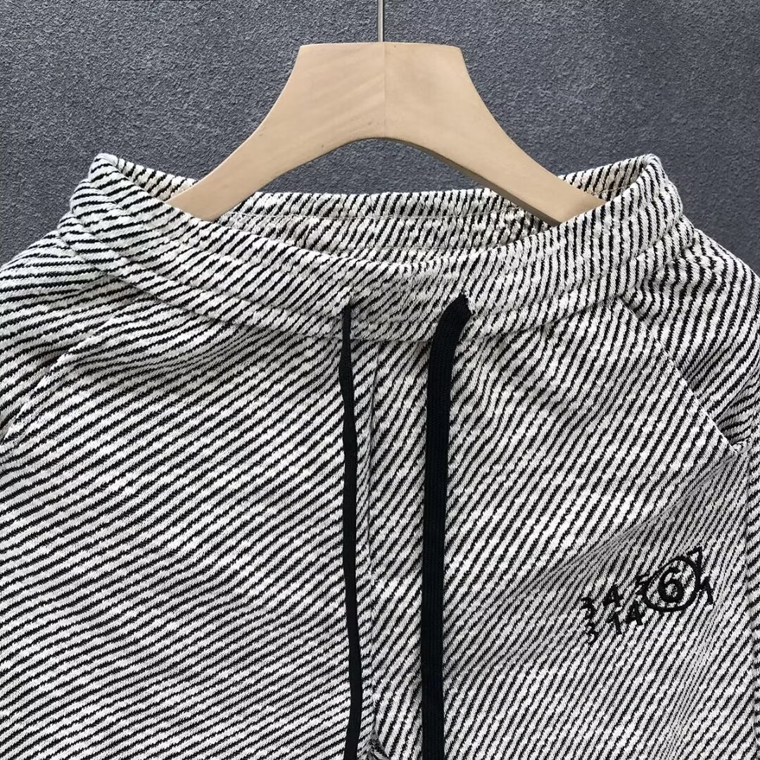 Verano delgado estilo americano retro sensación de diseño simple pantalones cortos a rayas nicho de hombre grande pantalones casuales sueltos