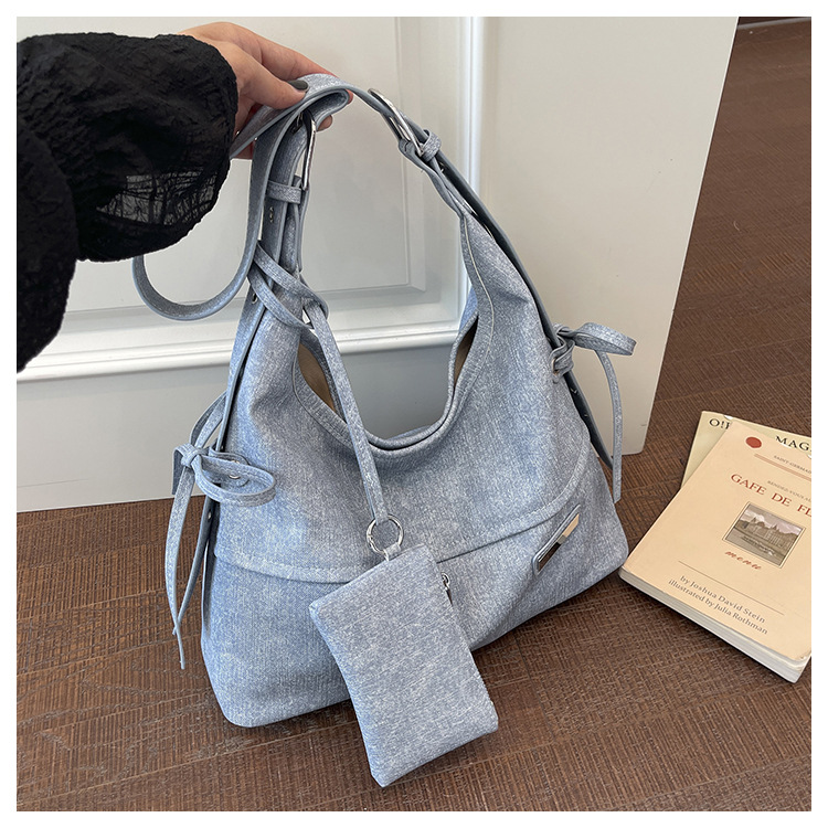 Bolso coreano de gran capacidad para mujeres 2026 verano nuevo viaje transfronterizo tote bag retro nicho mochila de hombro