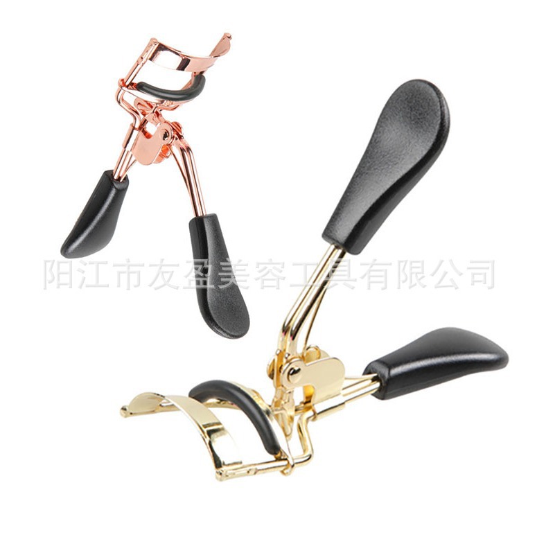 Golden eyelash curler contains rose