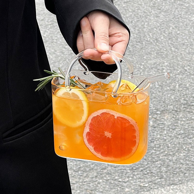 Bolsa de mano de vidrio transfronteriza, taza de té de fruta roja en línea, creativa transparente, extraña, taza de jugo de frutas de alto valor.