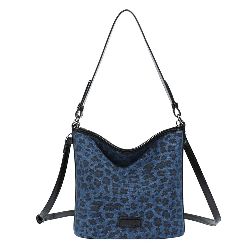 Niche Zhong esmaltado leopardo bolso de cubo para mujeres 2025 nuevo alta sensación de brazo de hombro bolso de transporte universal