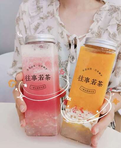Trendy square bottle milk tea cups: Commercial-grade 500ml PET cups with creative designs, made from durable plastic—perfect for single-use packaging, complete with lids.