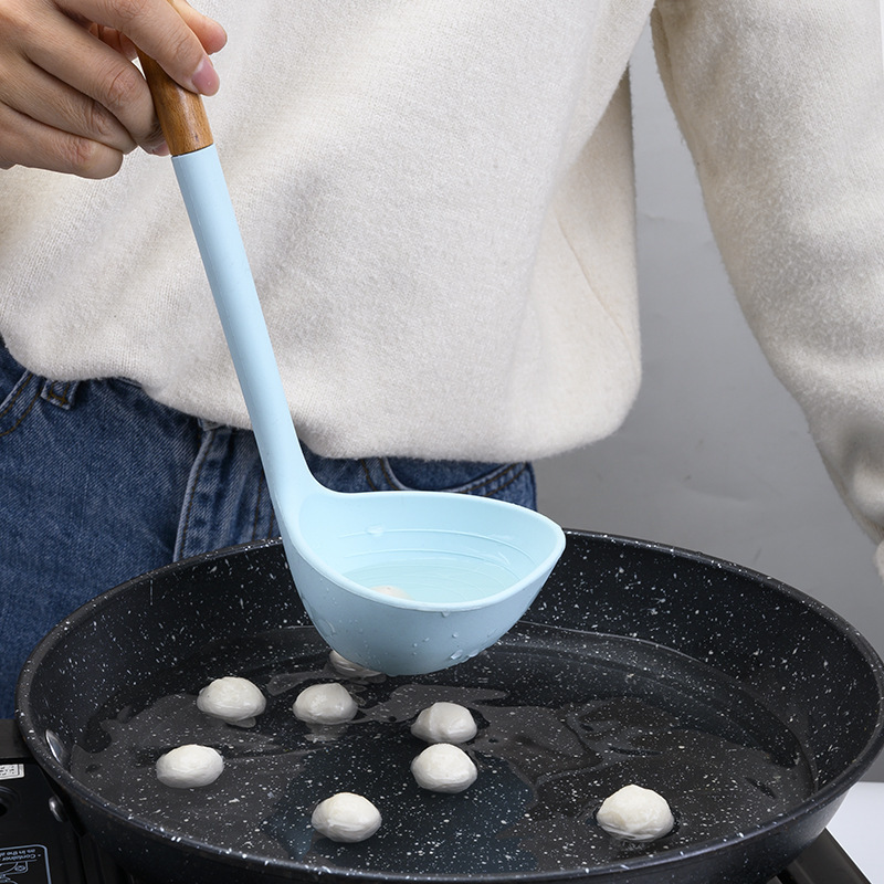 Suministros de cocina Mango de madera de silicona sartén antiadherente europea Espátula de silicona Juego de 10 piezas Juego de utensilios de cocina azul resistente a altas temperaturas