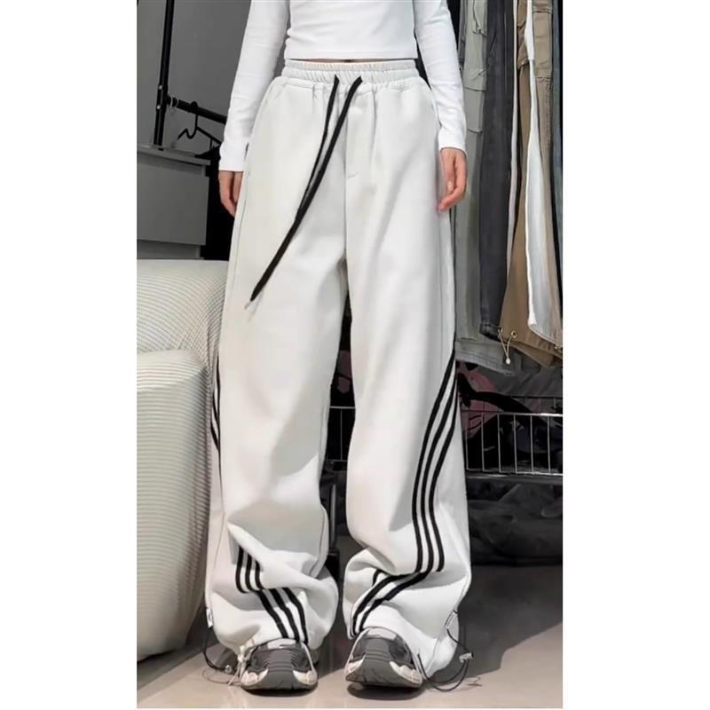 Pantalones deportivos casuales de mujer a rayas negras de la calle alta 2025 nuevo estilo de primavera y otoño sentido del diseño de tres barras pantalones anchos rectos