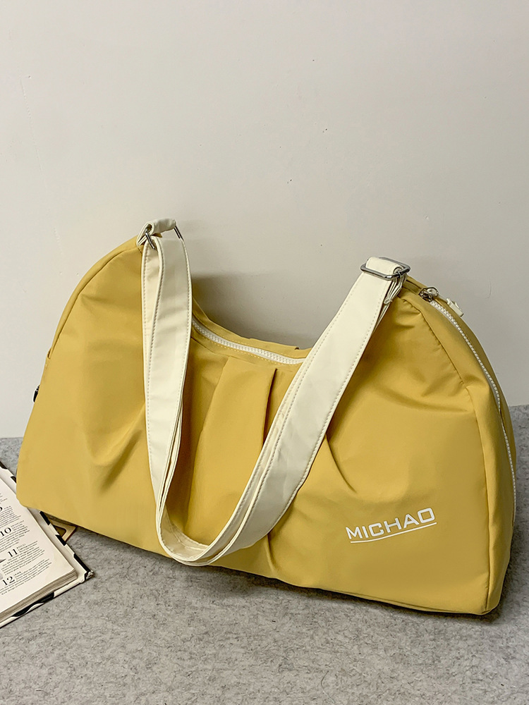 2025 nueva bolsa de equipaje para mujeres bolsa de excursión bolsa deportiva de gran capacidad bolsa de ejercicios bolsa de hombro ligera bolsa al por mayor