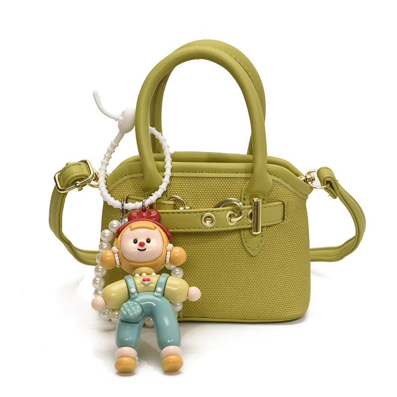 Bolsos de mano para niños lindos colgantes extranjeros mini bolsos de hombro para niños y niñas de color sólido simple bolsos de conchas de niños de moda