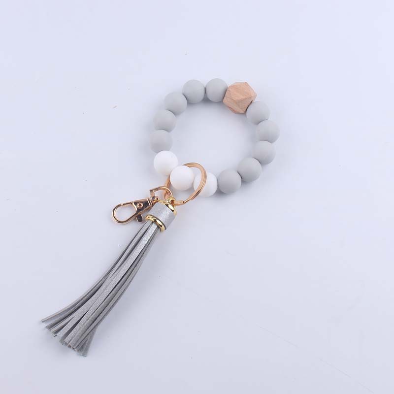 Pulsera de silicona pulsera llavero nuevo creativo DIY borla colgante contraste color