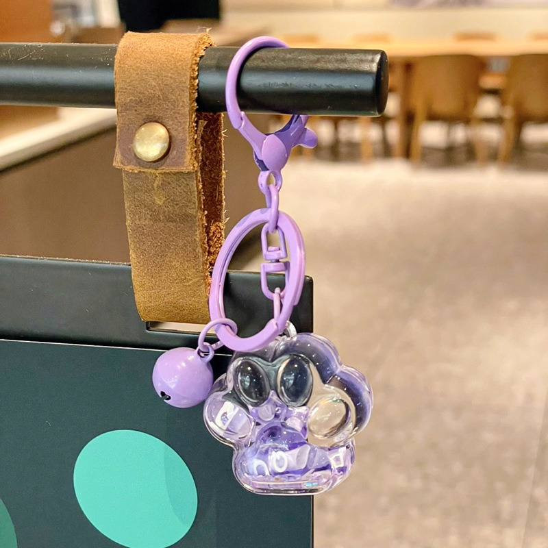 Caricatura en aceite líquido arena flotante botella mochila llavero delicado colgante accesorios accesorios máquina de muñecas pequeños regalos al por mayor