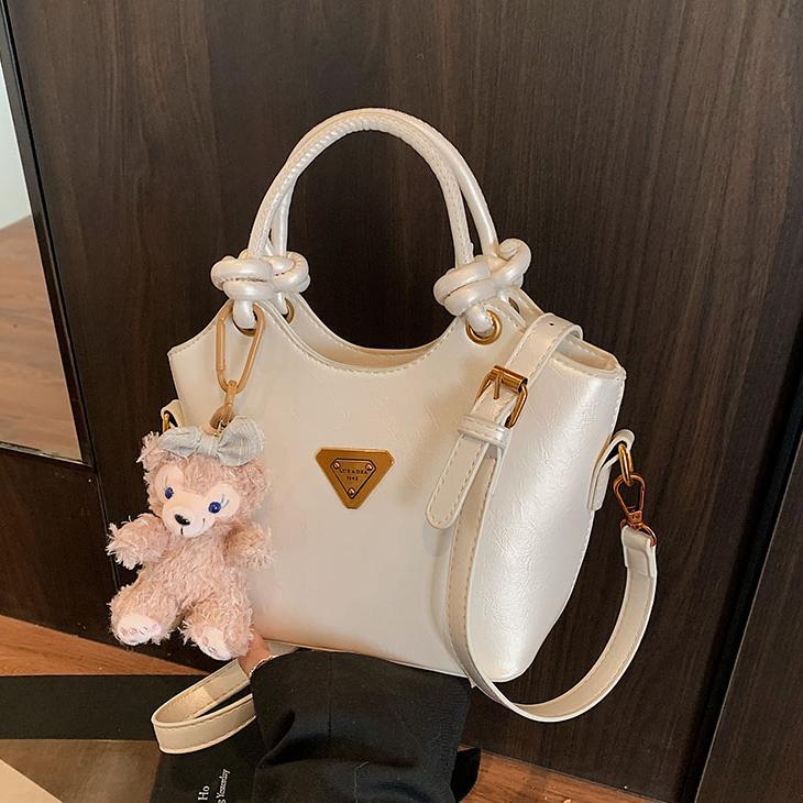 Nicho de diseño bolso de mano mujer 2025 nuevo estilo de moda bolso de hombro de aire extranjero sensación de alto nivel versátil bolso de cubo de transporte