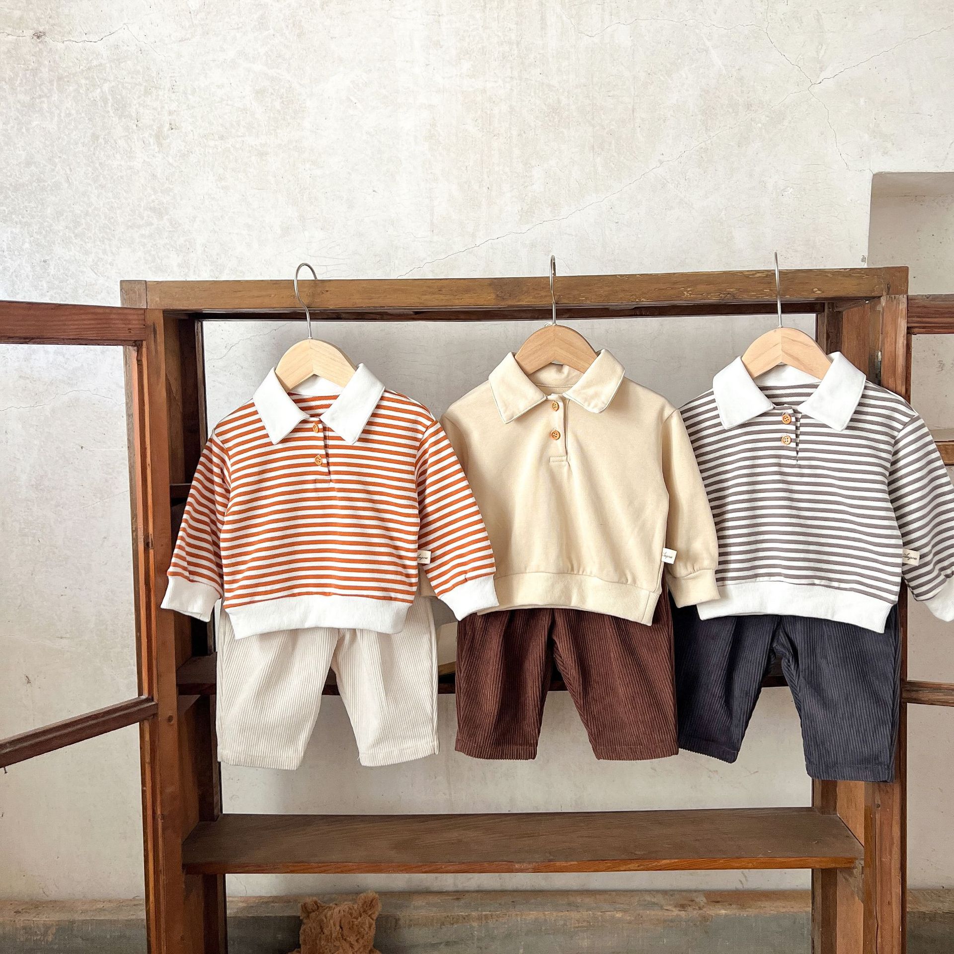 Estilo coreano ins suéter rayado del bebé neutral de los hombres flojos y niñas cuello POLO primavera superior
