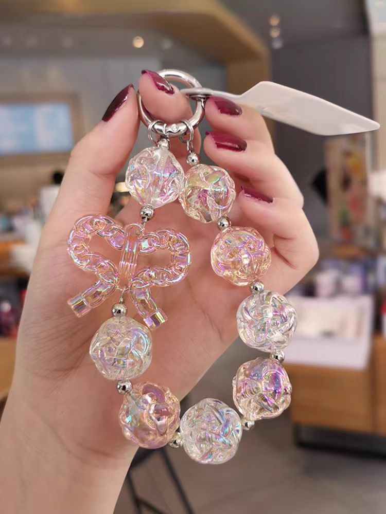 Colgante de teléfono móvil corto colgante de muñeca red rojo patrón delicado arco colgante de cuentas caja de teléfono móvil anti-perdida universal