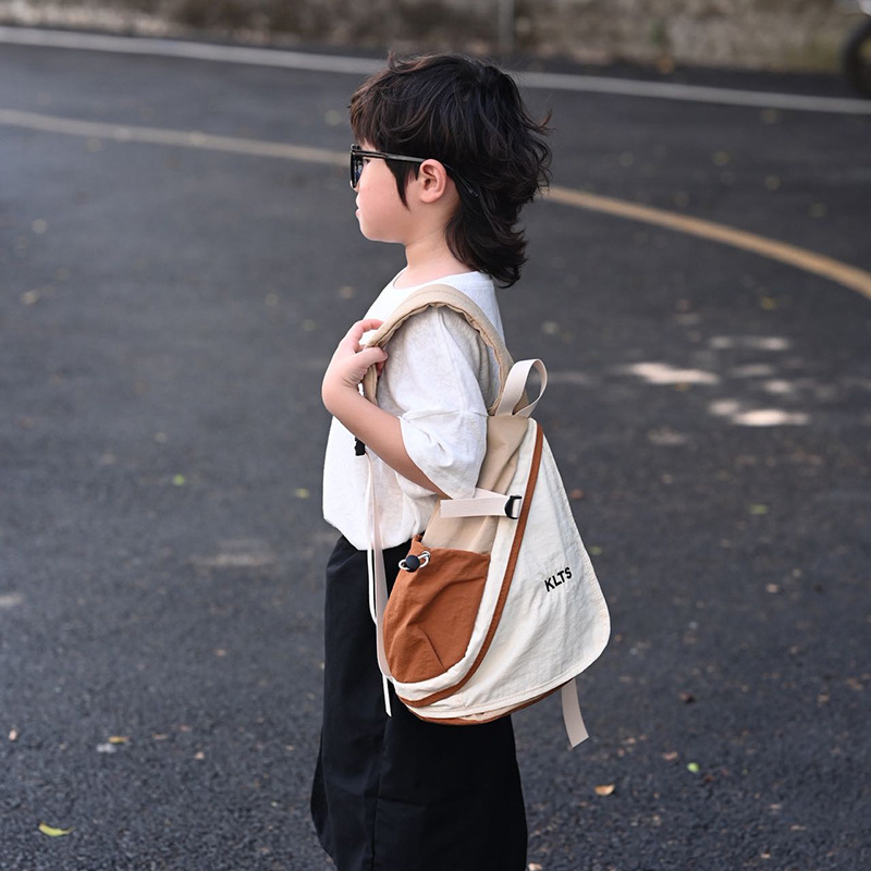 Coreano Chao Cool bolso de pecho para niños y niñas, moda de color contrastante, mochila de bebé de gran capacidad, mochila de hombro para niños casuales al aire libre