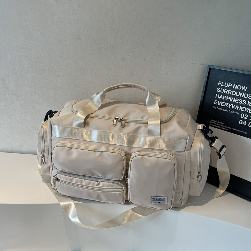 2025 nueva moda bolsa deportiva de fitness seca y húmeda separación bolsa de natación para hombres bolsa de viaje de hombro portátil de tela Oxford para mujeres