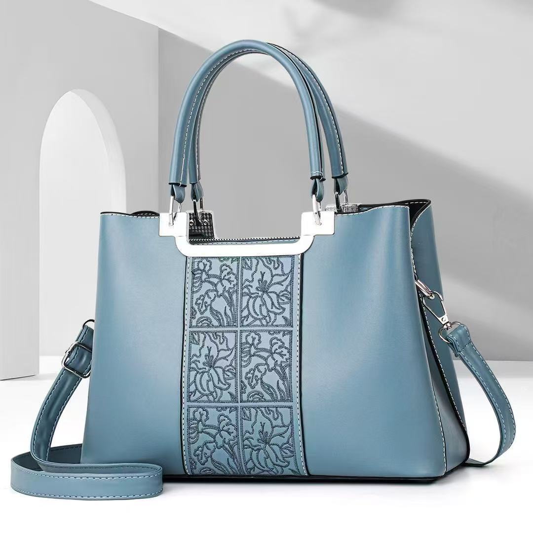 Bolso de madre atmosférico bolso de mujer simple de gran capacidad bolso de mensajero de hombro estilo explosivo bolso de marca de moda 2025