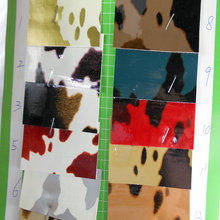 镜面PU印花奶牛纹皮革 无痕镜面环保人造革大小奶牛纹鞋包革面料