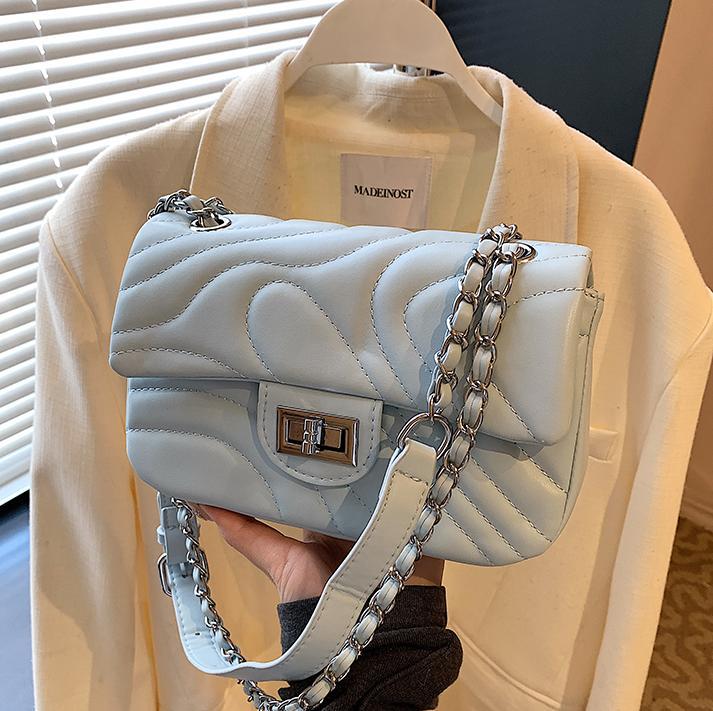 Bolsos de cadena de moda de comercio exterior para mujer 2025 nuevo bolso de hombro con textura de todo fósforo de alta calidad