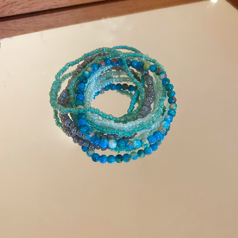 Pulsera de cuentas de arroz apilada de estilo bohemio, juego de siete piezas, pulsera de dopamina de alta calidad, joyería fresca de nicho al por mayor