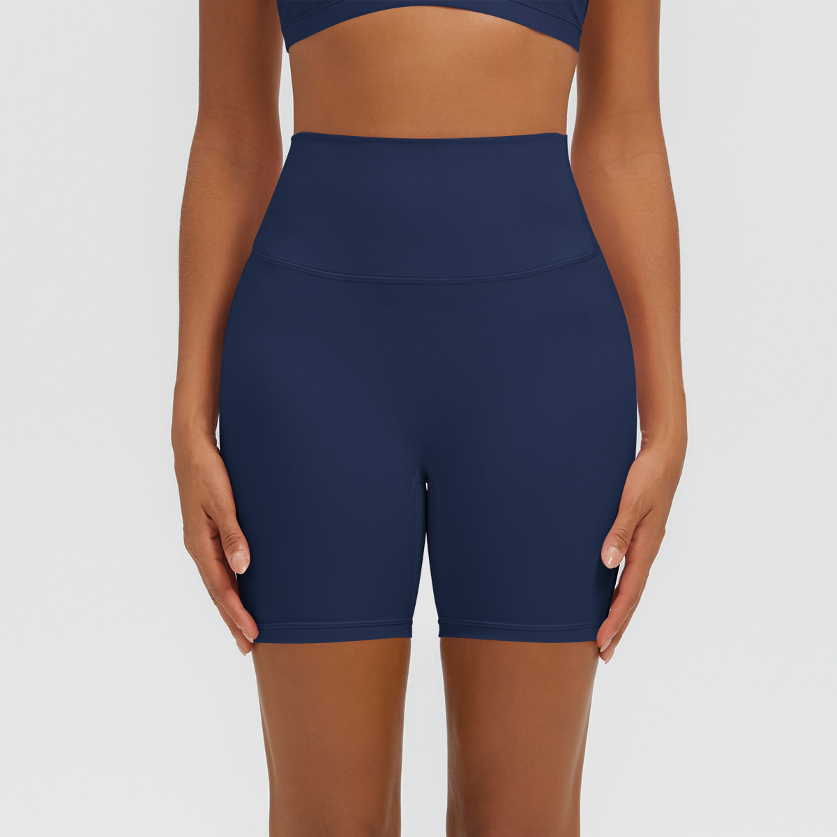 Nuevo tipo delgado de hielo, piel transpirable, ajustado, color sólido, ropa de yoga, pantalones cortos de tres puntos.