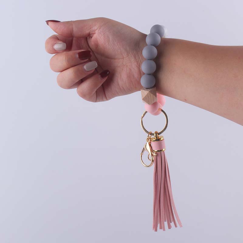 Nuevo cuero creativo pu borla colgante silicona muñeca llavero colgante silicona cuentas pulsera llavero