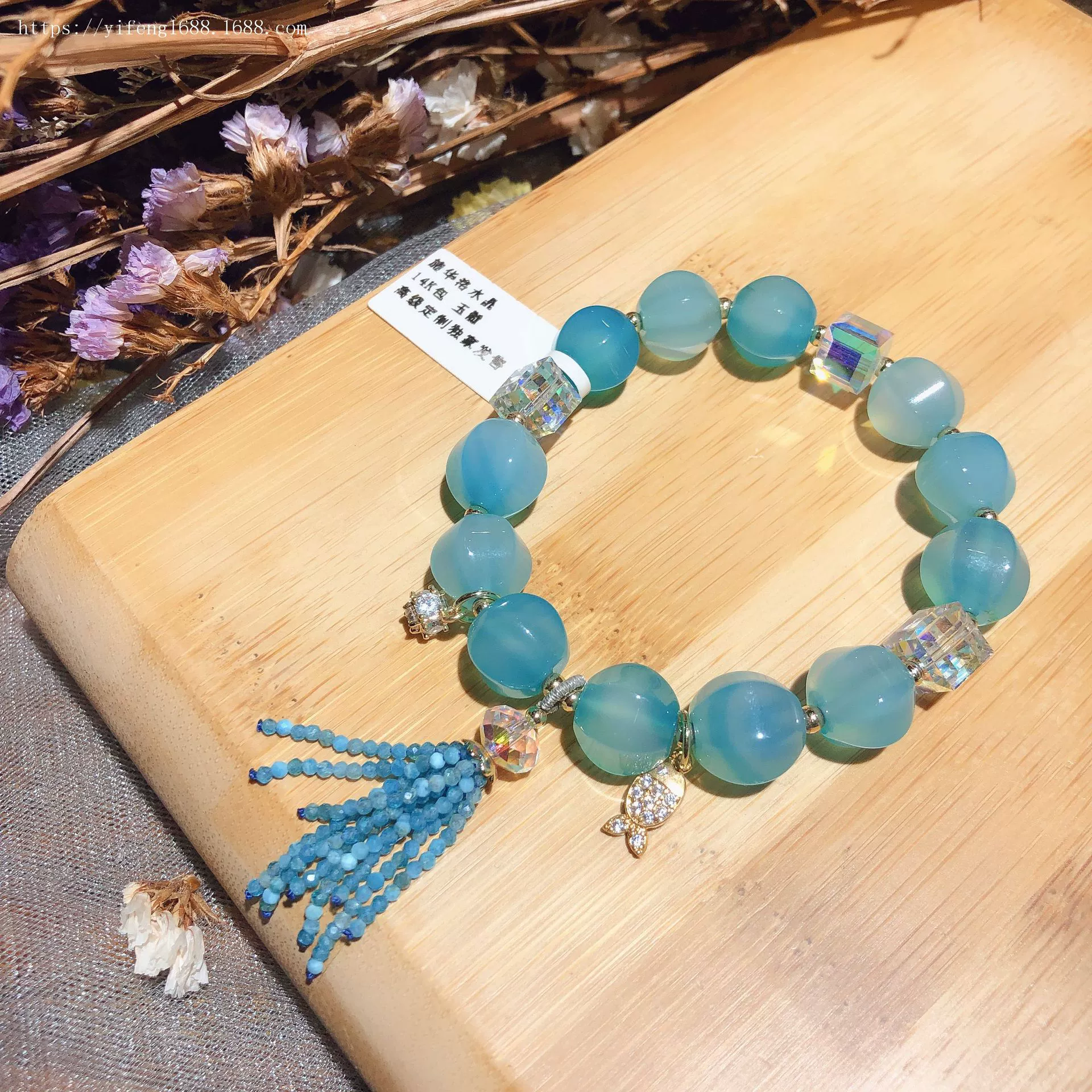 Blue bracelet with tassels, red pendant, accessory
