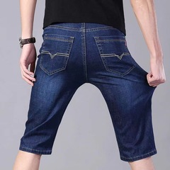 夏の薄いジーンズの半ズボンの男性の5分のズボンのまっすぐな筒の弾力の仕事は耐摩耗性が5分のズボンの工事現場の中のズボンを着ることに耐えます。