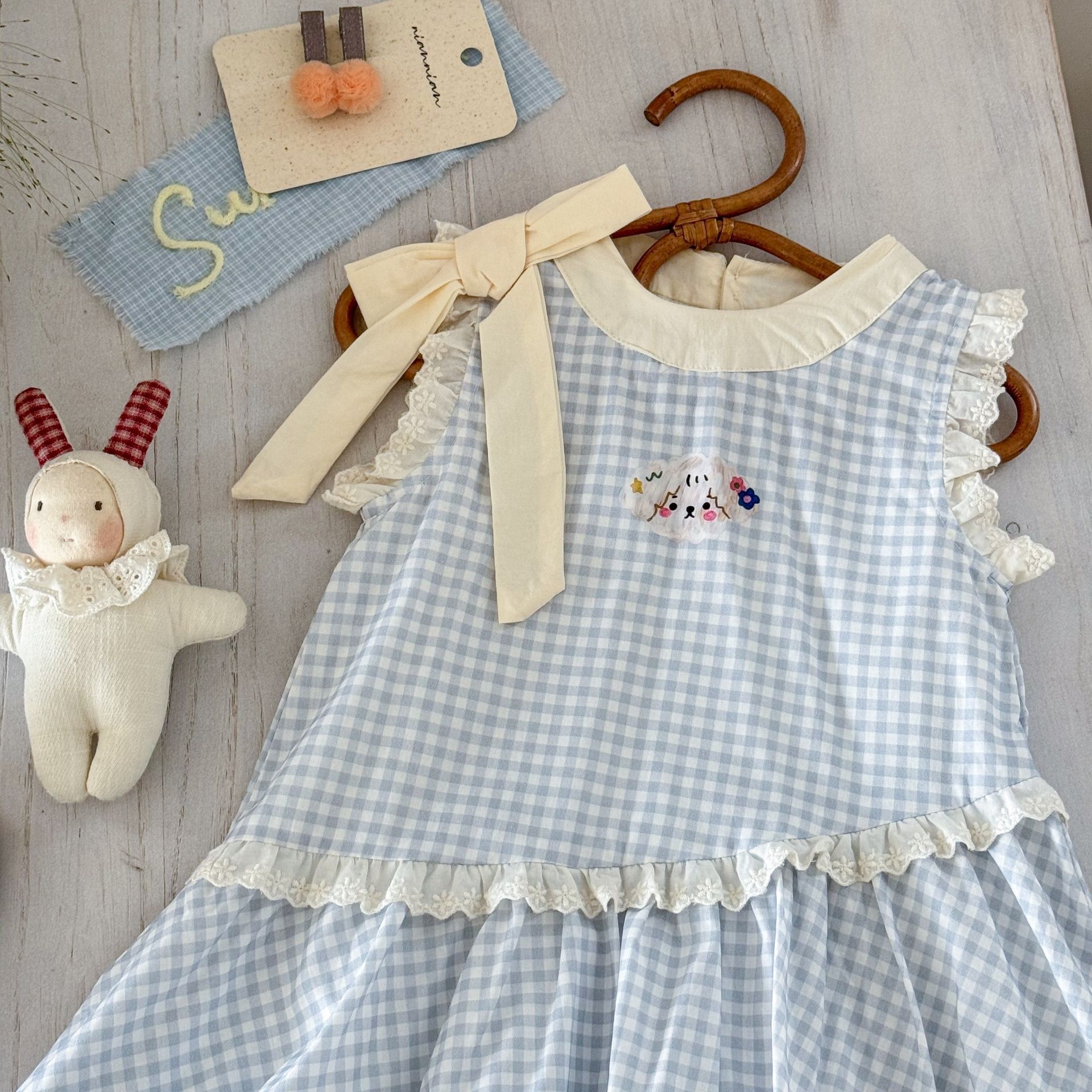 Vestido de siete niñas de limón salado verano versión coreana de dulce lazo azul a cuadros bebé lindo chaleco de capullo de flor falda de moda