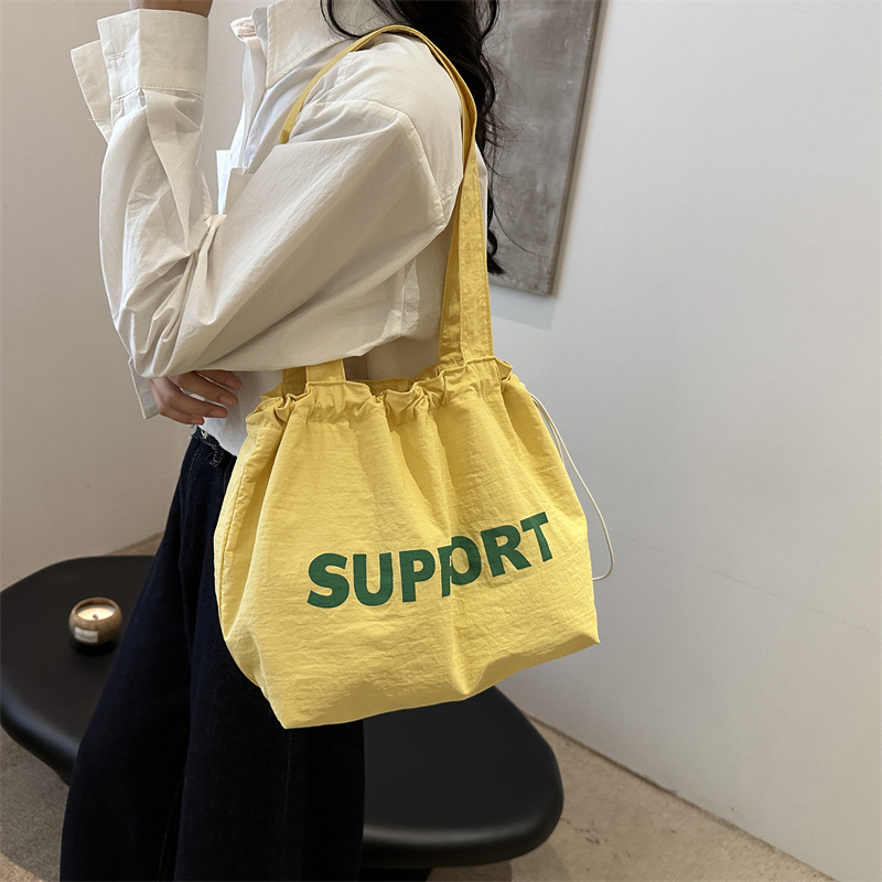 letras coreanas bolsas de lona para mujeres 2024 otoño nuevo relajado bolsas de clase de estudiantes universitarios de gran capacidad bolsas de nylon