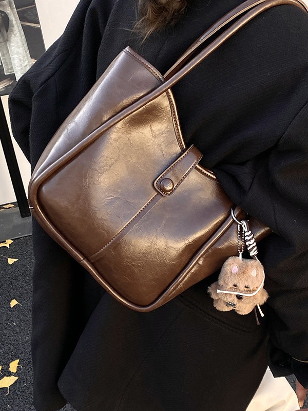 Este año, la moda simple bolso de cubo de mujer venta caliente nueva textura de alta calidad retro versátil lujo ligero bolso de hombro