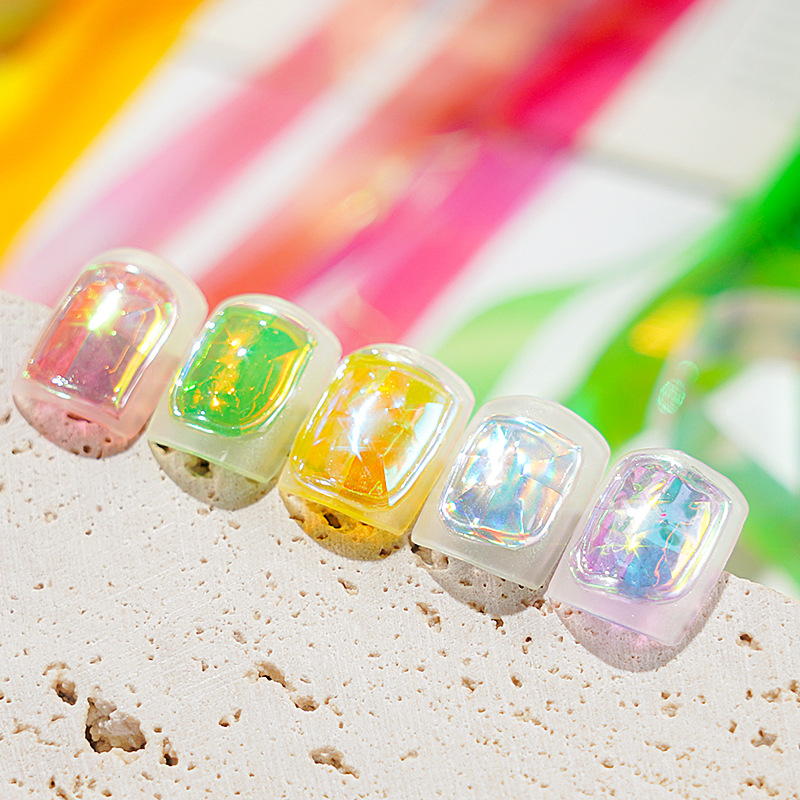 Nuevo arte de uñas transfronterizo cielo estrellado papel 1CM en caja Aurora papel de caramelo celofán arte de uñas joyería láser cielo estrellado papel