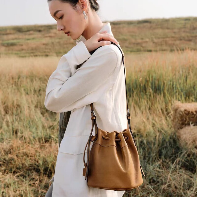 Sheepskin Cloud-Shaped Small Bucket Bag with Genuine Vegetable-Tanned Leather, Casual Shoulder Crossbody Drawstring Bucket Bag for Commuting, Spring and Summer Small Bag for Women Sheepskin Cloud-Shaped Small Bucket Bag with Genuine Vegetable-Tanned Leather, Casual Shoulder Crossbody Drawstring Bucket Bag for Commuting, Spring and Summer Small Bag for Women