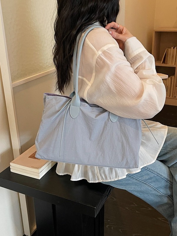2026 nuevo paquete de moda de tela de alta capacidad, bolso de hombro de alta calidad, bolso de bolsillo pequeño y multifuncional.