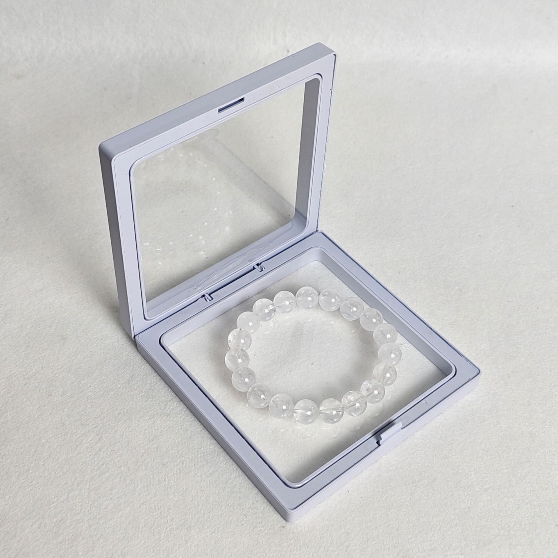 White pe film box; length and width 9*9cm, thickness 2cm