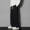 Black trousers, loose straight fit