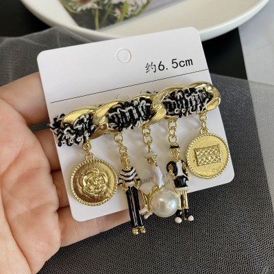 新型の美しいレトロな合金の潮の風はドリルのフリンジバッジの鉄塔の女性の優雅なブローチを入れてアクセサリーの卸売りを配合します。