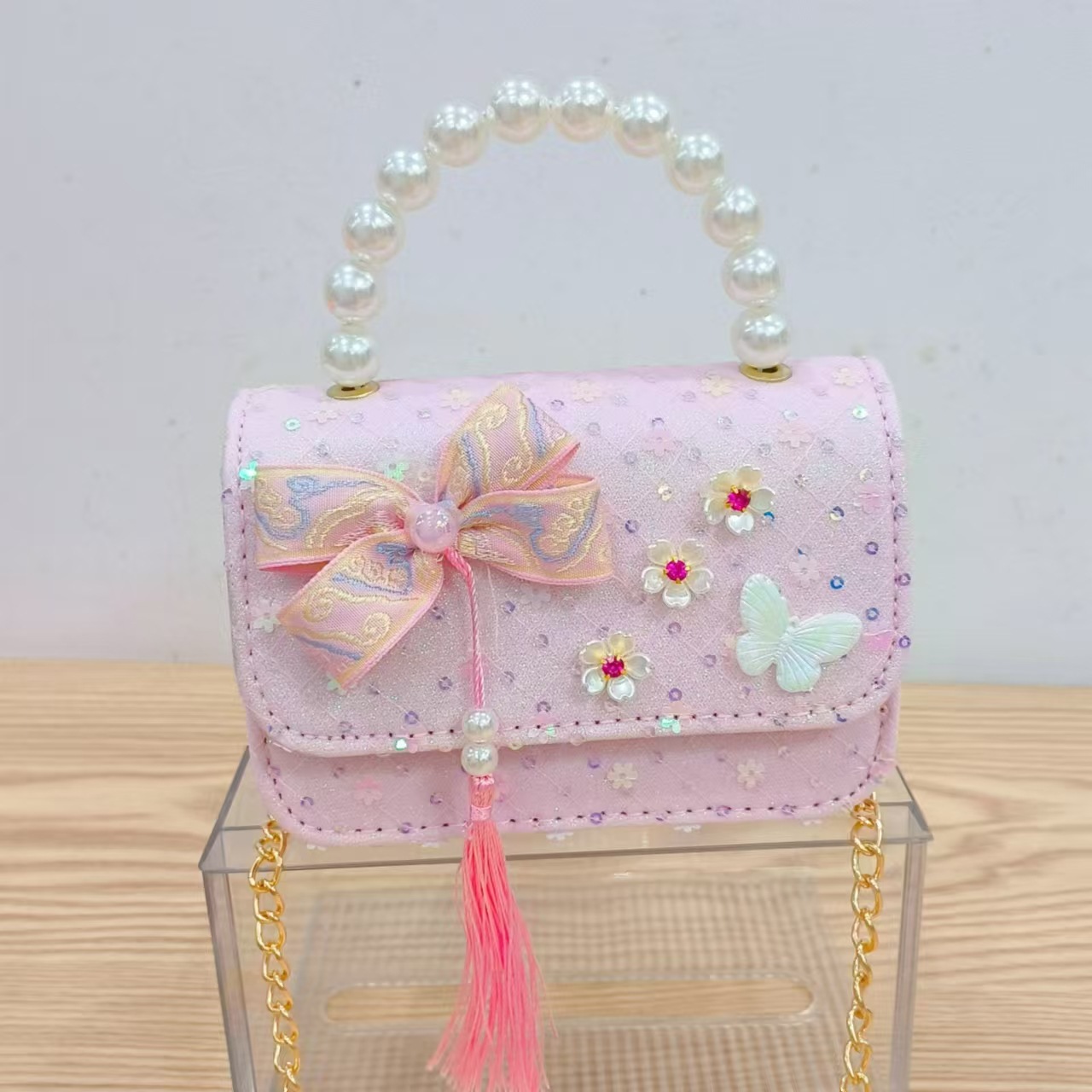 Niños pequeños viento fragrante hombro alto sentido de la chica antigua bolso de cambio princesa perla accesorios de ropa china portátil mochila
