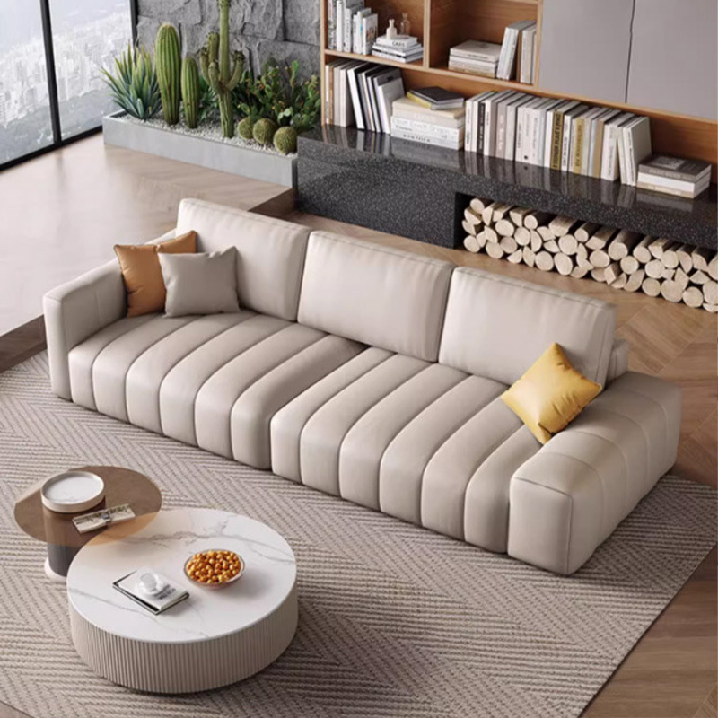 Estilo italiano Luz de lujo estilo crema primera capa de sofá de piel de vaca apartamento grande y pequeño abajo esponja suave cubierta de acero piano clave sofá de cuero