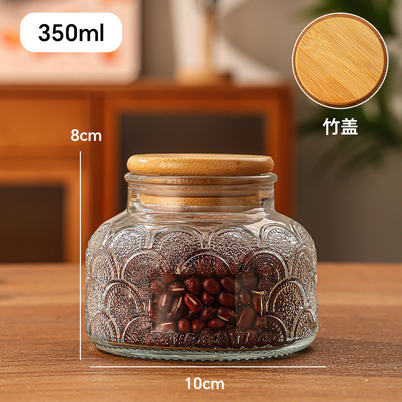 Relieve gran barriga tanque de almacenamiento de vidrio sellado cocina frutas secas granos alimentos almacenamiento al por mayor latas de dulces transparentes
