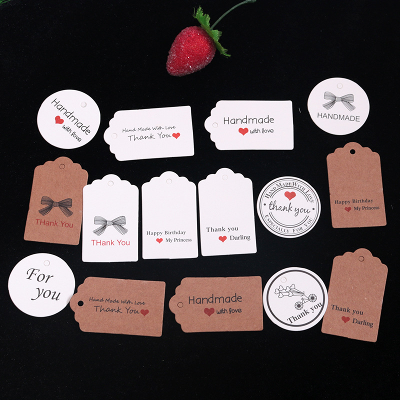 现货2022新款牛皮纸标签儿童服装吊牌卡通圆形价格牌可爱圣诞吊牌