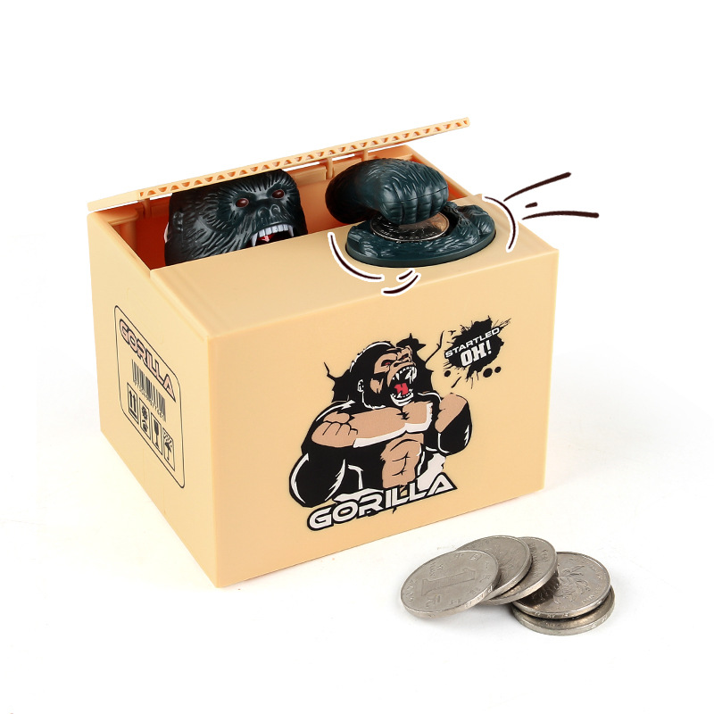 Juguetes de ocio para niños dibujos animados eléctricos robar dinero dinosaurio fruta caja moneda hucha comer dinero orangután hucha