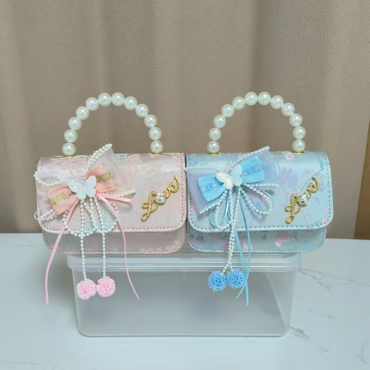 Bolsos infantiles de alto nivel antiguo bolso de cambio de niña pequeña princesa de perlas accesorios de ropa Han bolso de almacenamiento