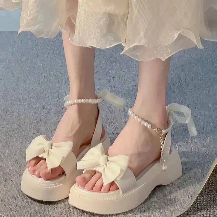 Sandalias de vacaciones coreanas de princesa para mujeres verano 2026 nuevo arco de fondo grueso estilo de hadas con falda zapatos romanos image 3