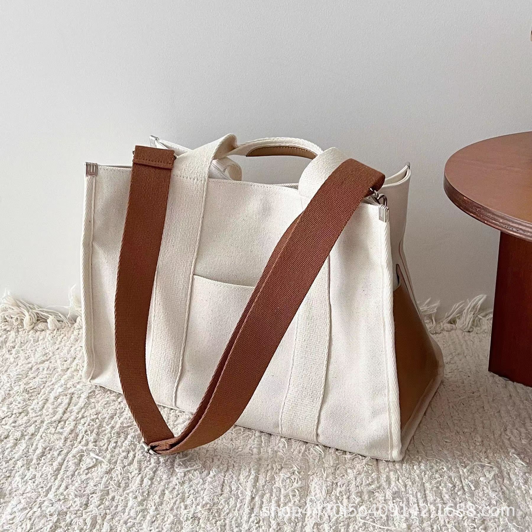 Bolsa coreana de gran capacidad simple para mamás, bolso de hombro portátil, bolso impermeable, pañales de lona, bolso para madre y bebé.
