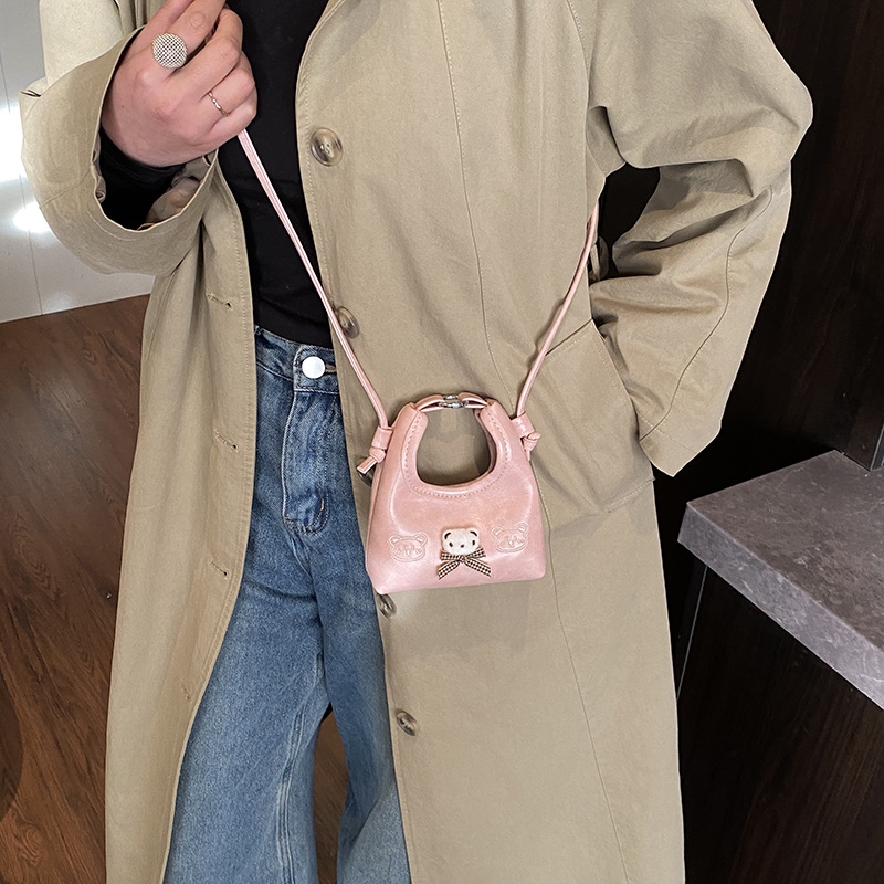 2026 nuevo bolso infantil de dibujos animados osos mini bolso de mano bebé adorable bolso de accesorios de niña pequeña