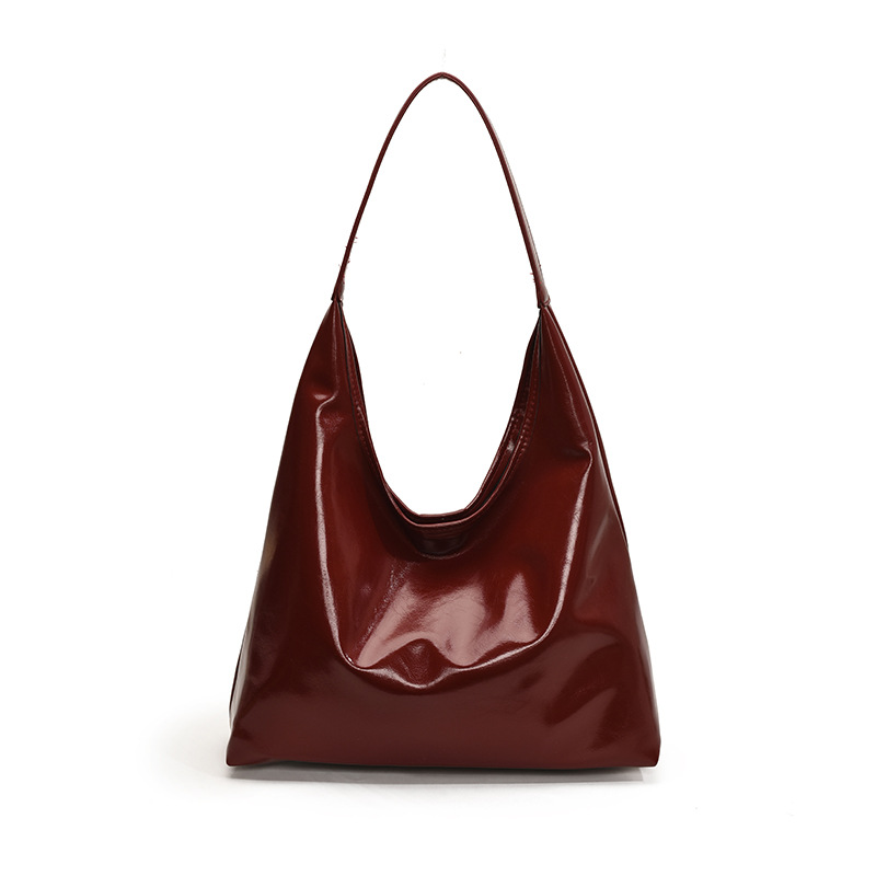 Bolsa de brazo retro de viaje para mujeres 2025 nueva moda popular bolso de hombro de cuero suave sensación de gran capacidad bolsa de mano