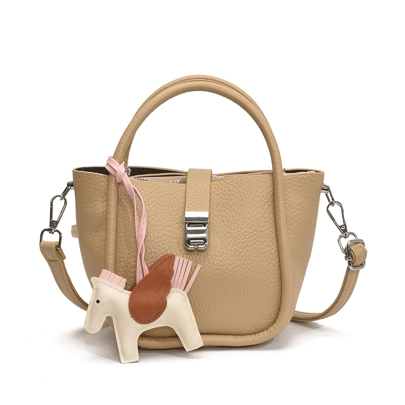 Bolso de cubo para mujer, tendencia transfronteriza de alta gama, bolso de mano con patrón de lichi, viaje diario, bolsa de mensajero de canasta de verduras de estilo occidental