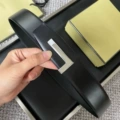 Brushed silver base with silver plate buckle, black flat grain strap, 3.8cm wide